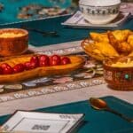 a table topped with bowls filled with food