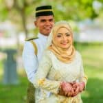 a man and a woman dressed in traditional garb