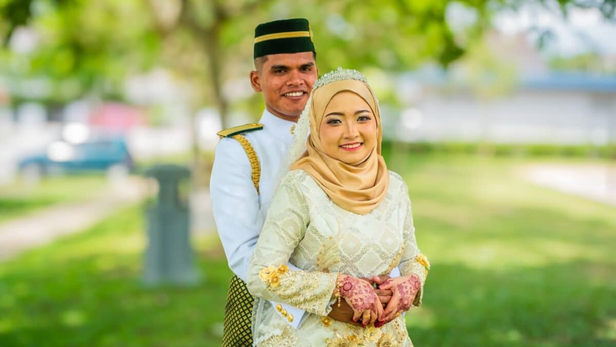 a man and a woman dressed in traditional garb