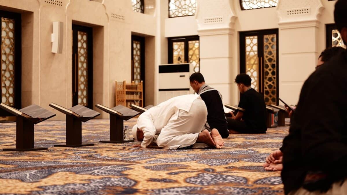 a group of men sitting on the floor in a room