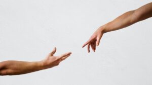 persons hand on white wall