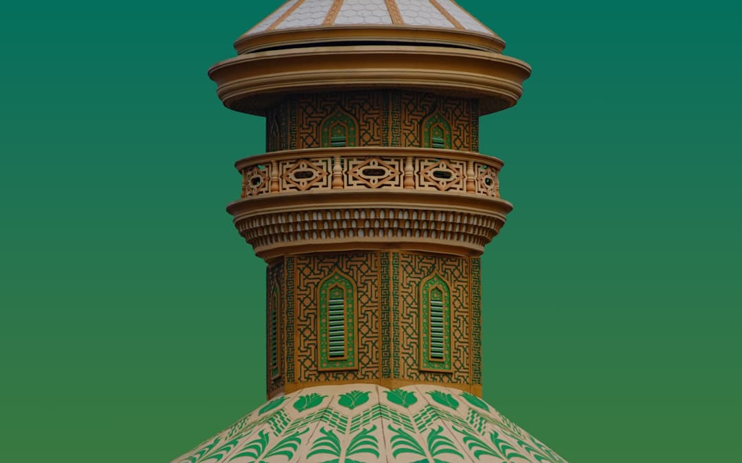 A tall building with a white and green roof