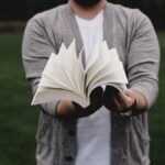 person opening book